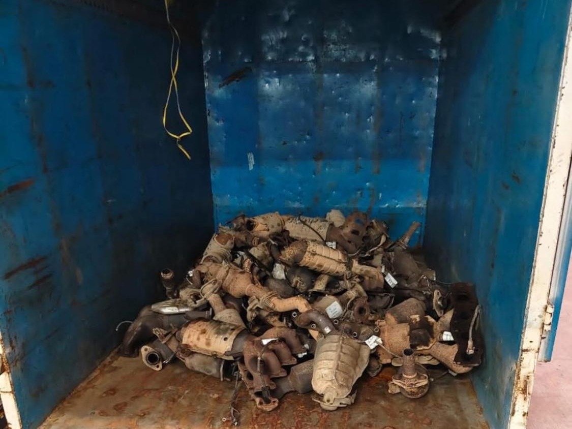 A collection load of spent catalytic converters in the body of a truck